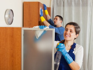 26110430 - professional cleaners team working at living room